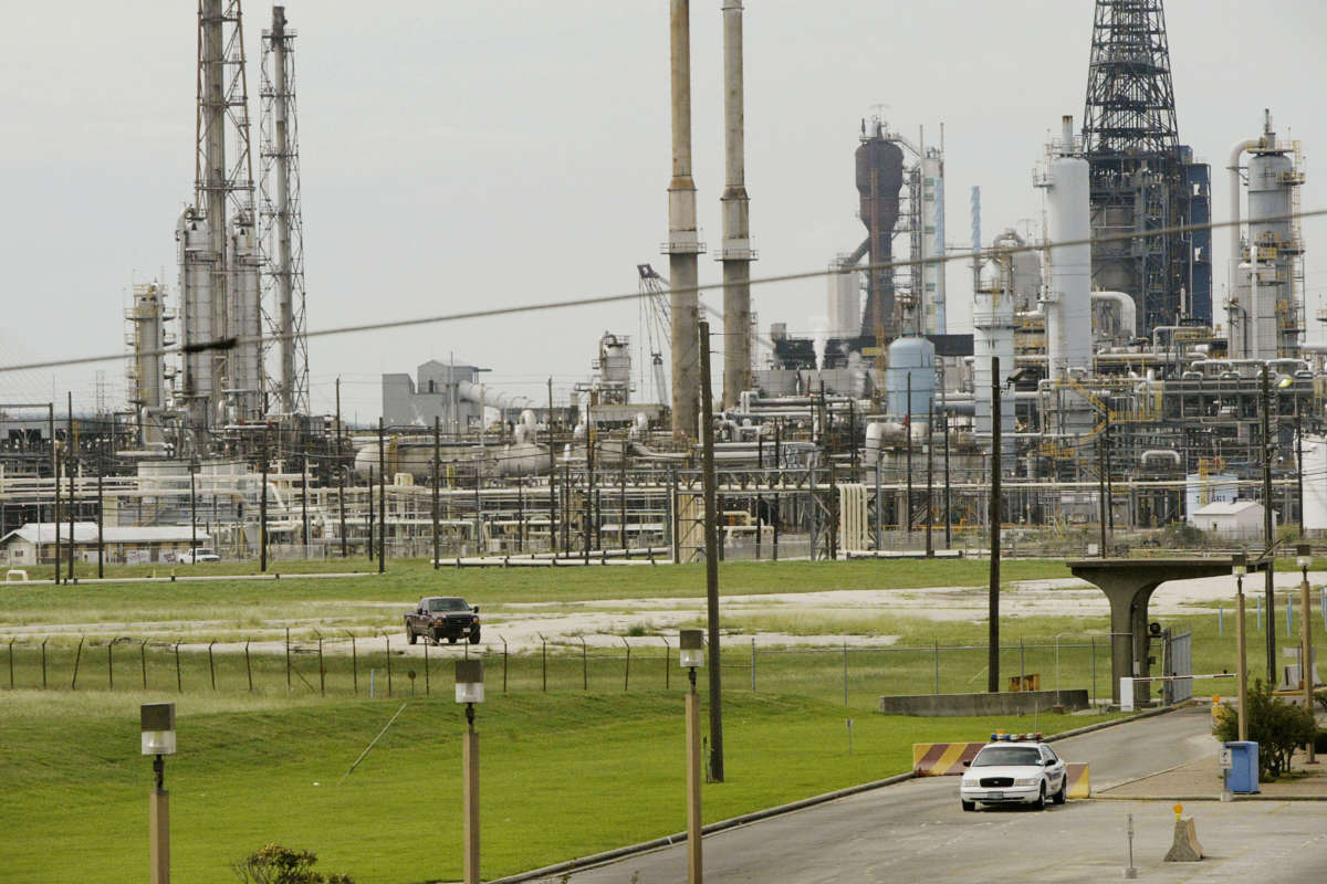 A security vehicle sits outside an Exxon/Mobil refinery on September 23, 2005, in Baytown, Texas.