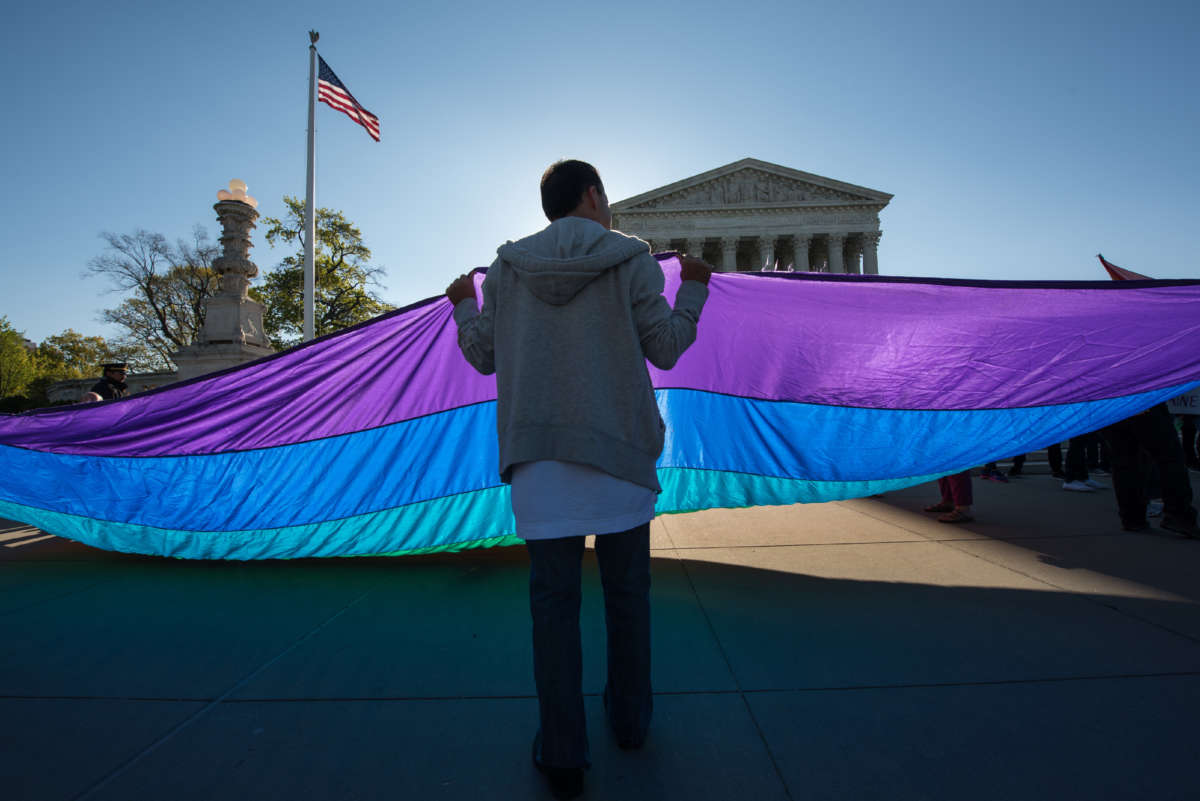Demonstrators in favor of and opposed to same-sex marriage rally outside the Supreme Court in Washington, D.C., on April 28, 2015.