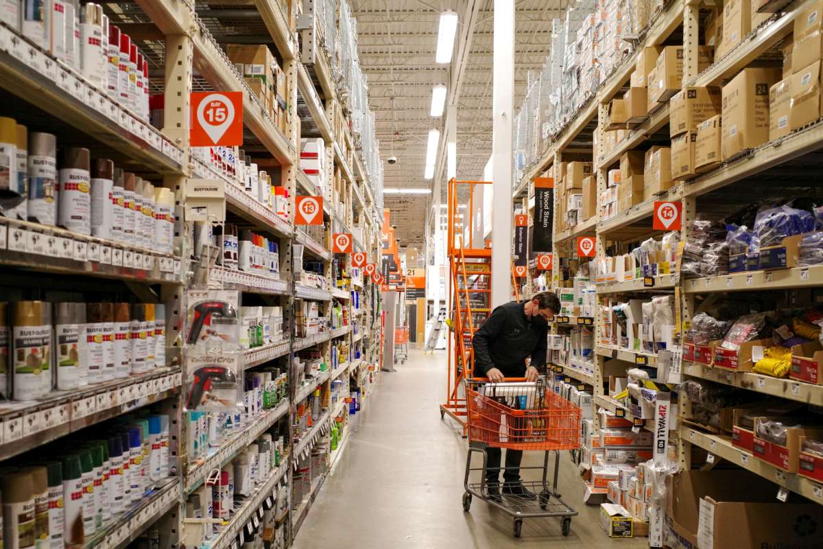 A shopper places items in a cart at a home improvement store in Bethesda, Maryland, on February 17, 2022.
