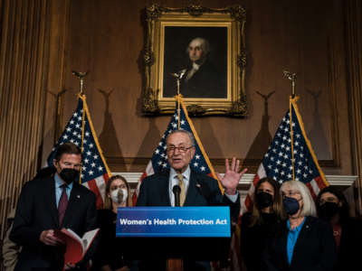 Senate Majority Leader Chuck Schumer, flanked by Sen. Richard Blumenthal and Sen. Patty Murray, speaks during a news conference at the U.S. Capitol on February 28, 2022, in Washington, D.C.