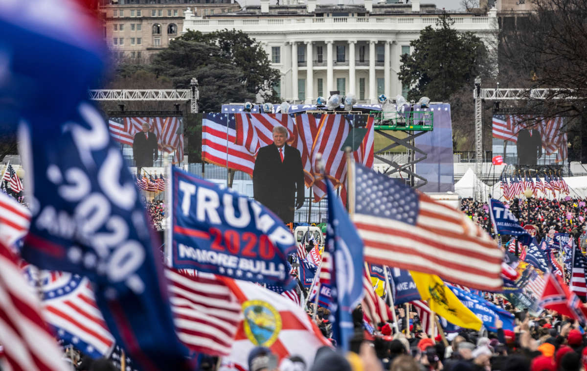 President Donald Trump is seen on a screen as his supporters cheer during a rally on the National Mall on January 6, 2021, in Washington, D.C.