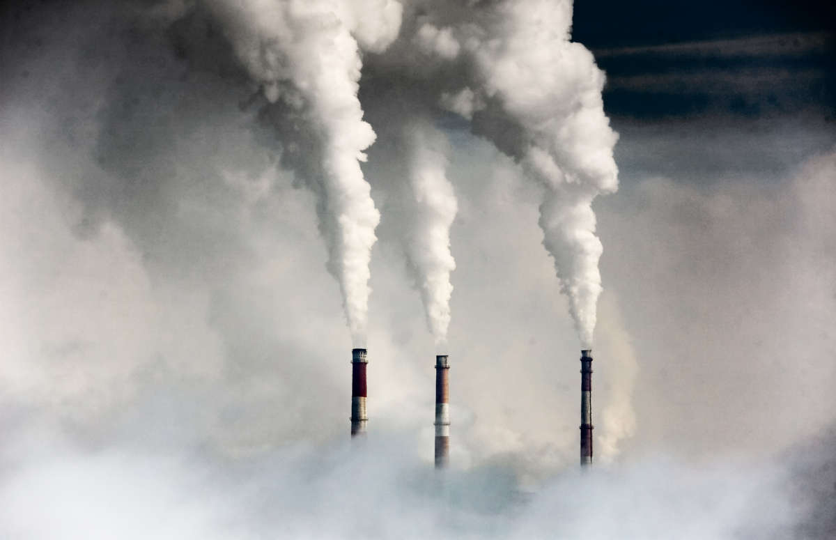 Smokestacks emit fossil fuel smoke