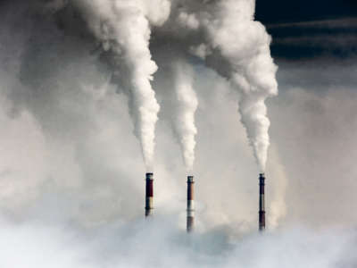 Smokestacks emit fossil fuel smoke