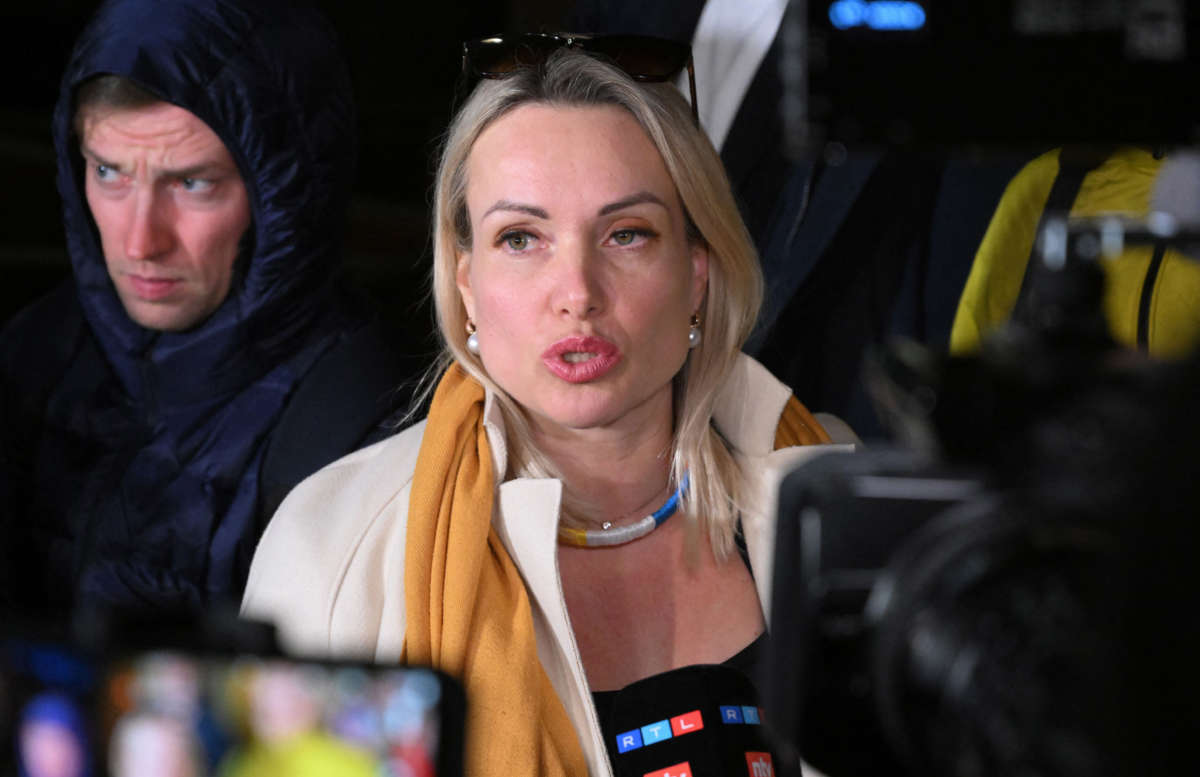 Marina Ovsyannikova, the editor at the state broadcaster Channel One who protested against Russian military action in Ukraine during the evening news broadcast at the station, speaks to the media as she leaves the Ostankinsky District Court after being fined for breaching protest laws in Moscow on March 15, 2022.