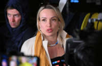 Marina Ovsyannikova, the editor at the state broadcaster Channel One who protested against Russian military action in Ukraine during the evening news broadcast at the station, speaks to the media as she leaves the Ostankinsky District Court after being fined for breaching protest laws in Moscow on March 15, 2022.