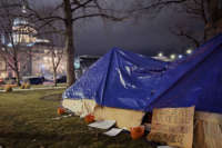 Night falls on the Occupy-style protest for unhoused rights in Boise, Idaho.