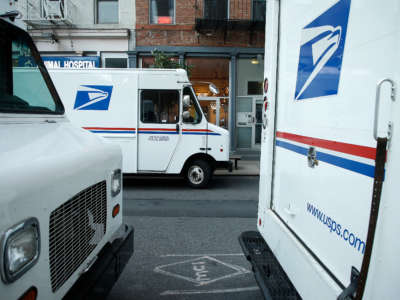 U.S. Postal Service trucks are seen parked on August 20, 2020, in New York City.