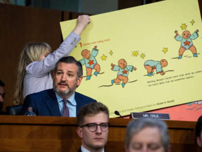 Sen. Ted Cruz references a page from the children's book Antiracist Baby while questioning Judge Ketanji Brown Jackson, President Biden's nominee for Associate Justice to the Supreme Court, on the second day of her Senate Judiciary Committee confirmation hearing in Hart Senate Office Building on Capitol Hill on March 22, 2022.