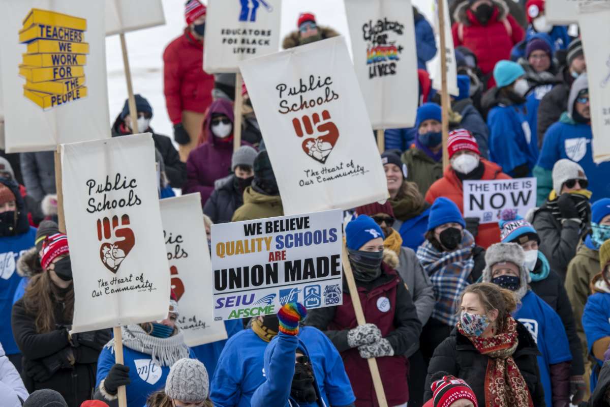 Teachers rally and march for better contracts in St. Paul, Minnesota, on February 12, 2022.