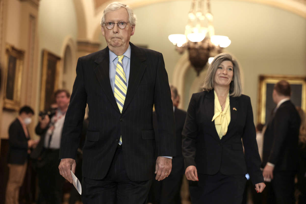Senate Minority Leader Mitch McConnell and Sen. Joni Ernst arrive at a news conference following the weekly Senate Republican policy luncheon at the U.S. Capitol Building on April 5, 2022, in Washington, D.C.