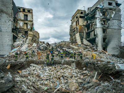 A rescue team clears debris of a destroyed building in Borodianka after combat during Russia's war in Ukraine.