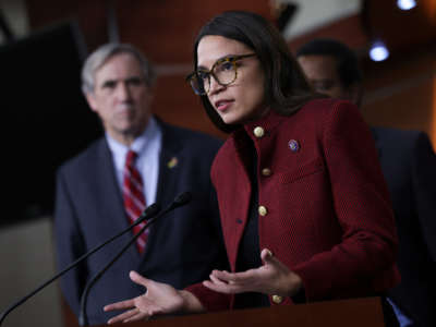 Rep. Alexandria Ocasio-Cortez, joined by Sen. Jeff Merkley, speaks on banning stock trades for members of Congress at news conference on Capitol Hill on April 7, 2022, in Washington, D.C.