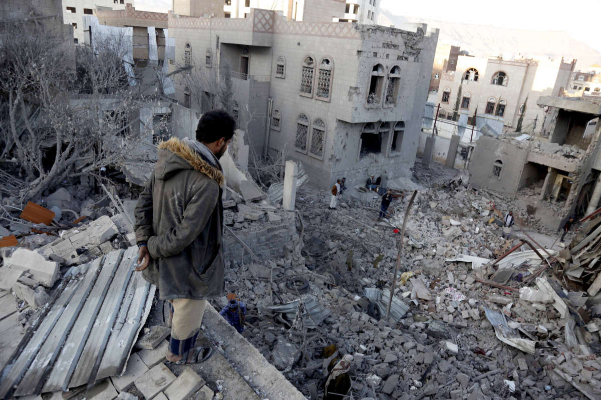 Yemenis inspect the damage from airstrikes by Saudi-led coalition forces in Sanaa, Yemen, on January 18, 2022.