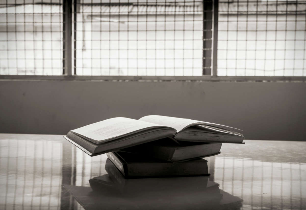 Pile of books on a table in prison