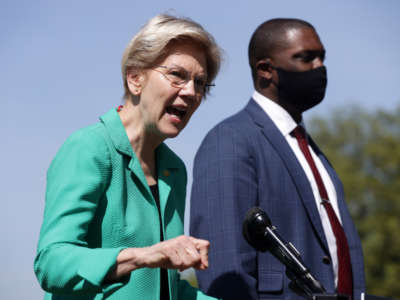 Sen. Elizabeth Warren speaks as Rep. Mondaire Jones listens during a news conference outside the U.S. Capitol on April 27, 2021, in Washington, D.C.