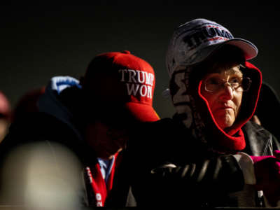 Supporters listen to former President Donald Trump speak during a rally at the Montgomery County Fairgrounds on January 29, 2022, in Conroe, Texas.