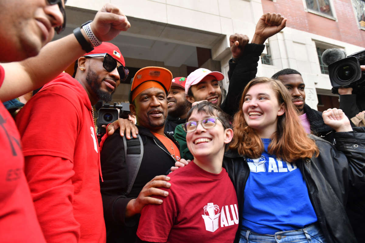 Union organizer Christian Smalls, left, celebrates following the April 1, 2022, vote for the unionization of the Amazon Staten Island warehouse in New York.