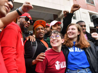 Union organizer Christian Smalls, left, celebrates following the April 1, 2022, vote for the unionization of the Amazon Staten Island warehouse in New York.