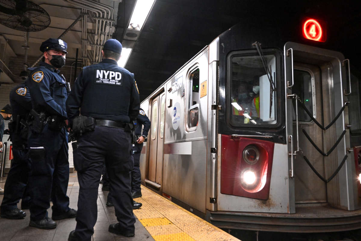 Members of the NYPD investigate an incident on an uptown 4 subway on April 12, 2022, in New York City.