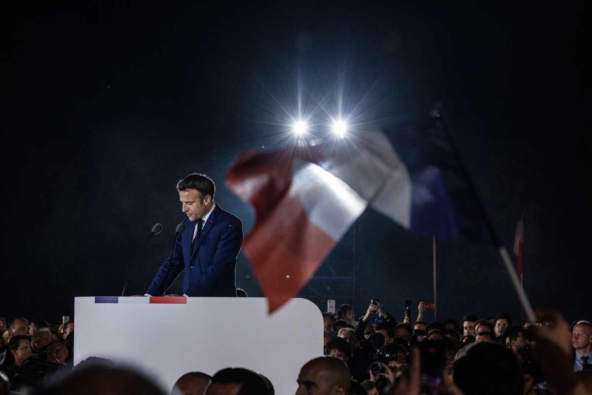 Emmanuel Macron speaks to a crowd of supporters