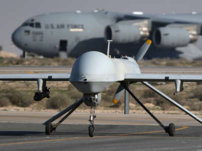 A U.S. Air Force MQ-1B Predator unmanned aerial vehicle lands at a secret air base in the Persian Gulf region on January 7, 2016.