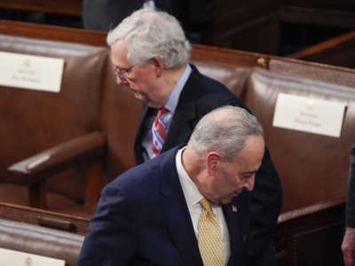 Senate Majority Leader Chuck Schumer and Senate Minority Leader Mitch McConnell arrive before President Joe Biden delivers his first State of the Union address to a joint session of Congress, at the Capitol on March 1, 2022 in Washington, D.C.