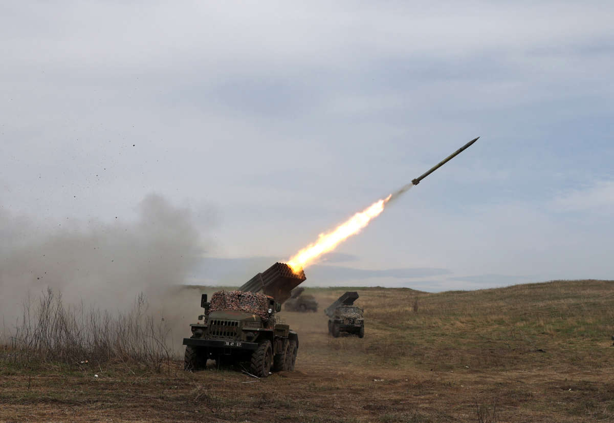 a rocket launcher launches rockets in Ukraine against Russian troops' position