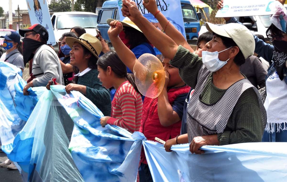 The caravan began in Puebla, where people marched past a Bonafont (Danone) water bottling plant and said their water is not for sale.