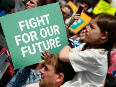 Activists protest at the Fight for Our Future: Rally for Climate, Care, Jobs & Justice in Lafayette Square near The White House on April 23, 2022, in Washington, D.C.