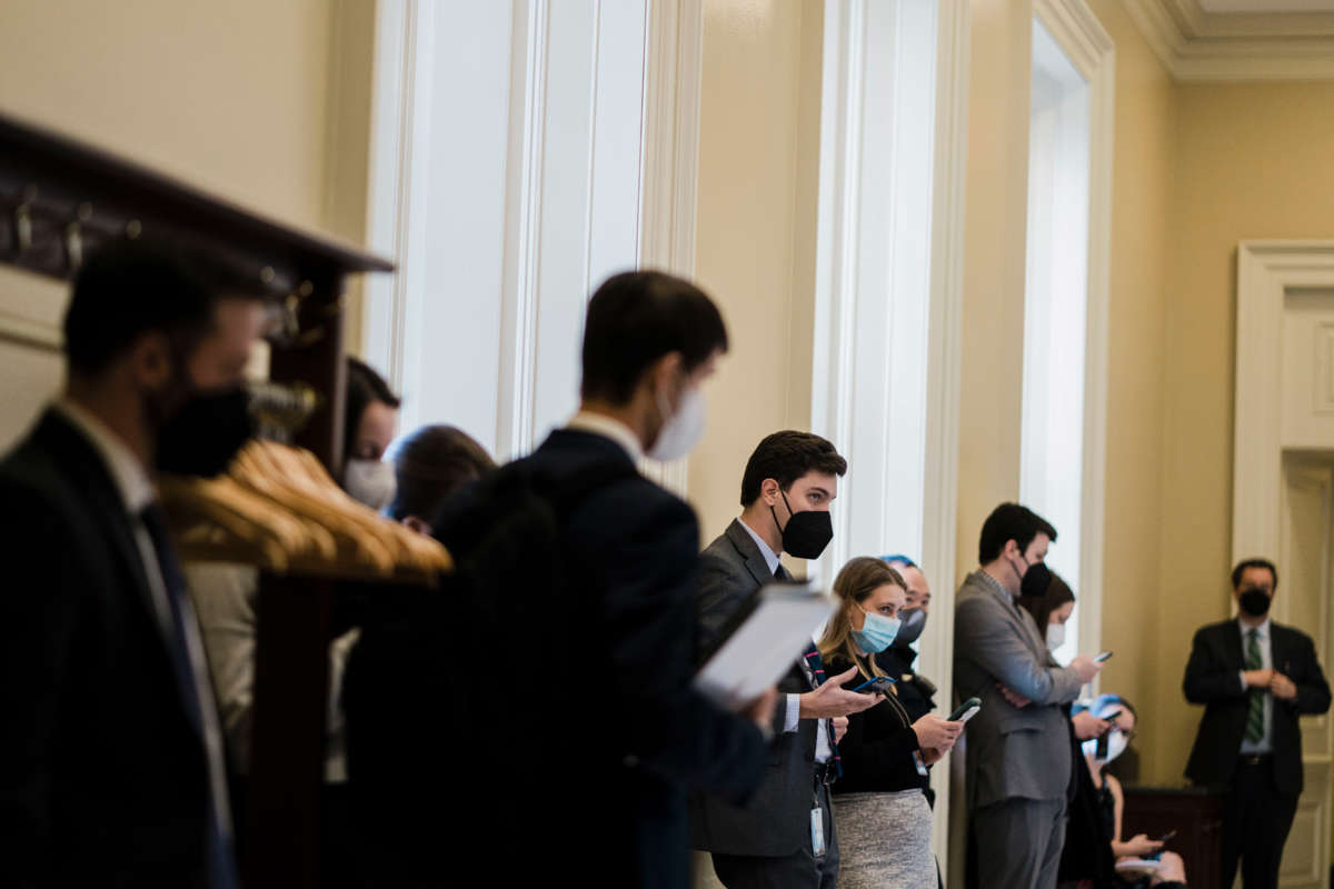 Capitol Hill staffers wait outside of a Senate weekly Democratic Party policy luncheon on February 15, 2022, in Washington, D.C.