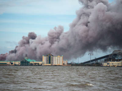 Smoke rises from a burning chemical plant after the passing of Hurricane Laura in Lake Charles, Louisiana, on August 27, 2020.