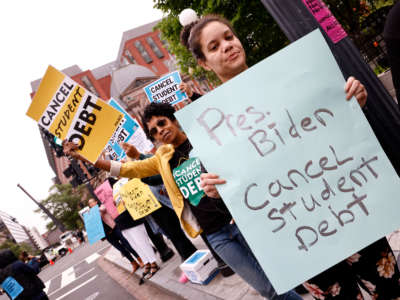 Student loan borrowers gather near the White House to tell President Biden to cancel student debt on May 12, 2020, in Washington, D.C.