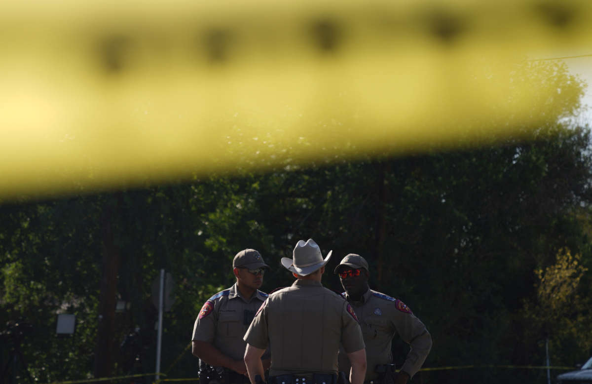 Officers stand outside Robb Elementary School in Uvalde, Texas, on May 25, 2022.