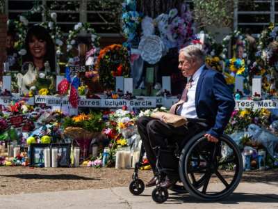 Texas Governor Greg Abbott arrives while President Joe Biden and First Lady Jill Biden pay their respects at a memorial outside of Robb Elementary School in Uvalde, Texas, on May 29, 2022.