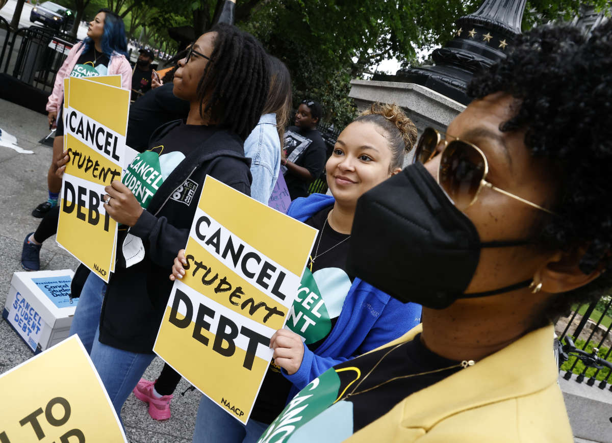 Student loan borrowers gather near The White House to tell President Biden to cancel student debt on May 12, 2022, in Washington, D.C.