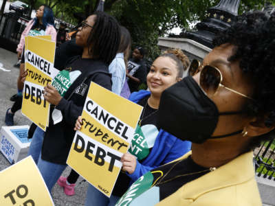 Student loan borrowers gather near The White House to tell President Biden to cancel student debt on May 12, 2022, in Washington, D.C.