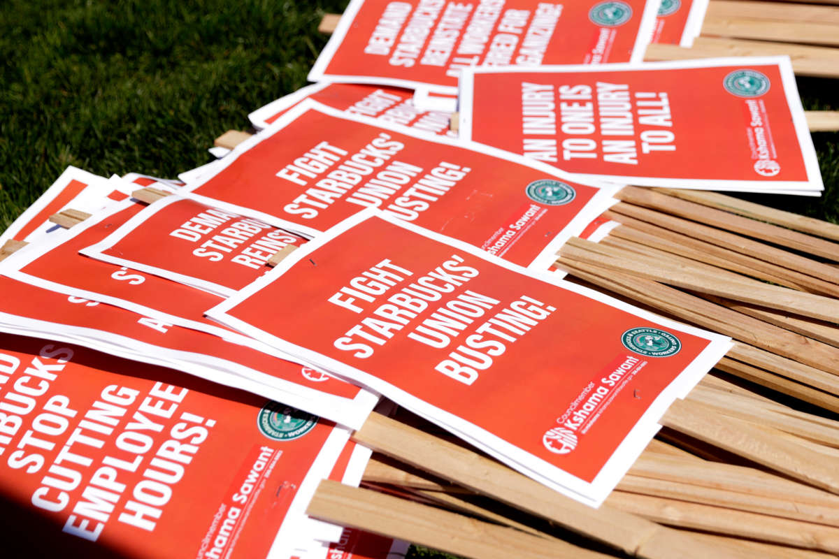 Picket signs are left for people to grab during the 'Fight Starbucks' Union Busting' rally and march in Seattle, Washington, on April 23, 2022.