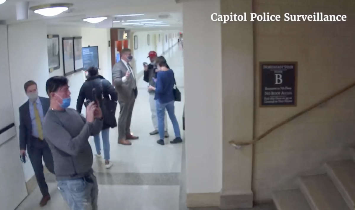 Surveillance footage shows a man on a tour led by Rep. Barry Loudermilk taking photos within the Capitol complex the day before attending the attack on January 6, 2021.