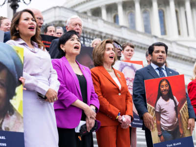 Front row from left, Reps. Veronica Escobar, Judy Chu, Speaker of the House Nancy Pelosi, Jimmy Gomez and Carolyn Maloney sing God Bless America, outside the U.S. Capitol before the House voted to pass the Bipartisan Safer Communities Act on June 24, 2022.