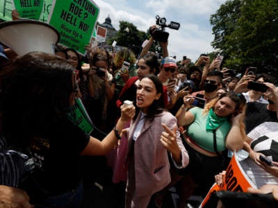 Rep. Alexandria Ocasio-Cortez speaks to abortion rights activists in front of the U.S. Supreme Court on June 24, 2022, in Washington, D.C.