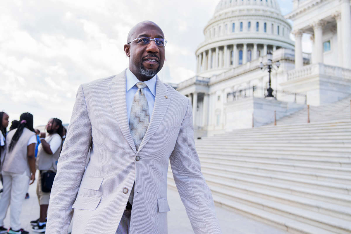 Sen. Raphael Warnock is seen at the Senate steps of the U.S. Capitol on June 9, 2022.