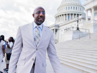 Sen. Raphael Warnock is seen at the Senate steps of the U.S. Capitol on June 9, 2022.