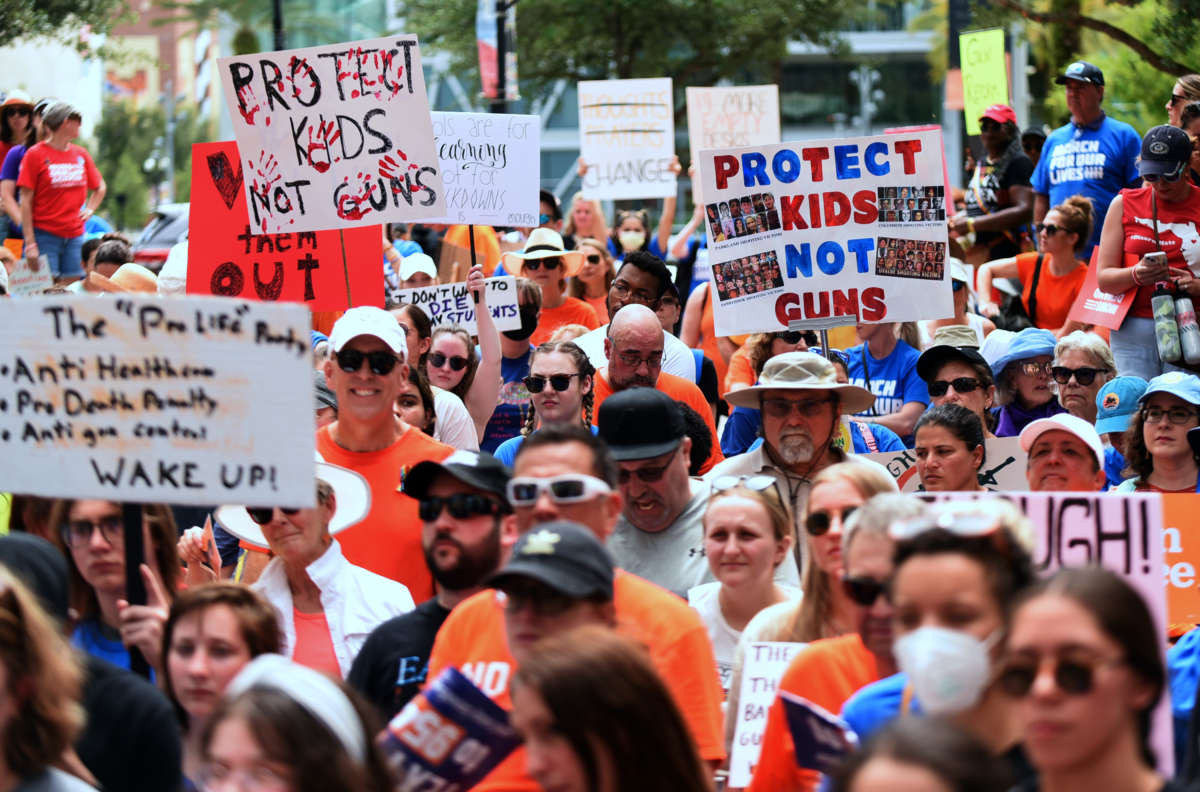 Protesters demanding action on gun violence participate in a "March For Our Lives" rally in Orlando, Florida, on June 11, 2022.
