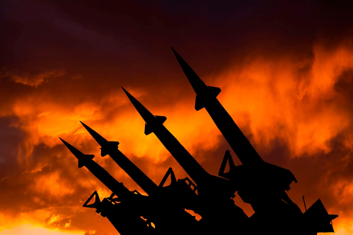 Nuclear missiles against fiery sky