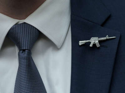 A congressional staffer wears a rifle shaped pin on his suit during a House Judiciary Committee mark up hearing on June 2, 2022, in Washington, D.C.
