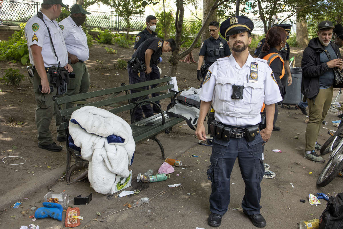 The New York City Department of Sanitation, backed up by police officers, conduct enforced removals of homeless encampments on June 23, 2022, in the Chinatown neighborhood of New York City, New York.