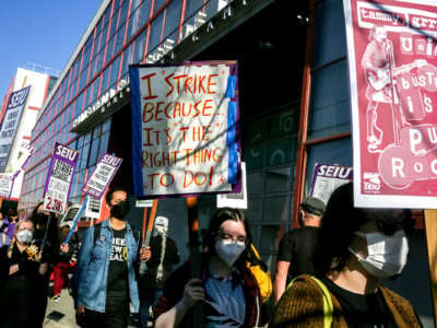 California College of the Arts' staff Matt Kennedy, center, strikes in protest of the school's alleged unfair labor practices outside of the building in San Francisco, Calif. on Tuesday, Feb. 8, 2022.