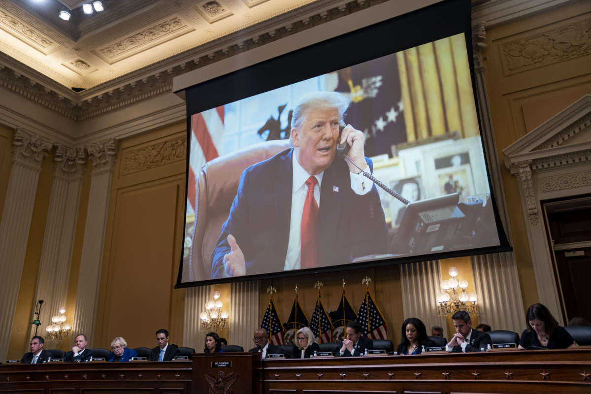 Donald trump is seen on a projection screen during the January 6th hearings