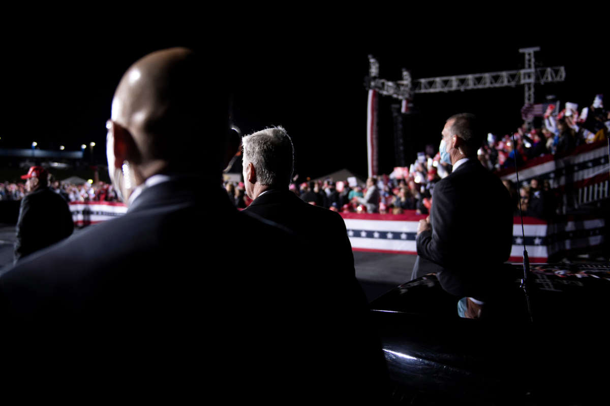Secret Service and others listen while then-President Donald Trump speaks during a rally at Hickory Regional Airport in Hickory, North Carolina, on November 1, 2020.