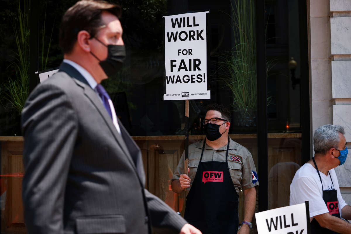 Activists with One Fair Wage participate in a wage strike demonstration outside of the Old Ebbitt Grill restaurant on May 26, 2021, in Washington, D.C.